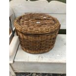 A ROPE AND SPLIT CANE TWO HANDLED BASKET WITH AN OVAL HINGED LID
