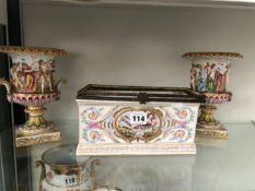 A PAIR OF CAPODIMONTE URNS MODELLED WITH BACCHIC FIGURES TOGETHER WITH A CAPODIMONTE BOX