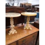 A PAIR OF WHITE COMPOSITION TRIPOD WINE TABLES MOULDED IN THE ORIENTAL STYLE WITH CHINESE