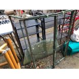 A VINTAGE IRON BAY WINDOW FRAME WITH TOP AND BOTTOM GLASS PANELS