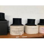 FOUR BOXED BLACK SILK TOP HATS