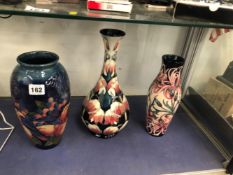 THREE MOORCROFT VASES AND A TABLE LAMP