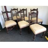 A SET OF SIX VICTORIAN MAHOGANY DINING CHAIRS, EACH WITH THE TOP RAIL CENTRED BY A ROSETTE,