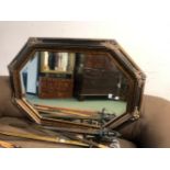 A BEVELLED EDGE OCTAGONAL DECORATIVE MIRROR. 110 x 81cms. TOGETHER WITH A TALL GILT FRAMED MIRROR (