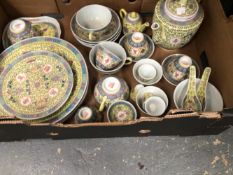 A CONTEMPORARY SET OF CHINESE PORCELAINS DECORATED WITH VINES ON A YELLOW GROUND