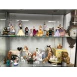 A COLLECTION OF PORCELAIN AND POTTERY FIGURES OF LADIES, ANIMALS AND SNOWMEN