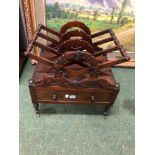 A VICTORIAN CARVED MAHOGANY ONE DRAWER CANTERBURY