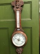 AN OAK BANJO CASED ANEROID BAROMETER WITH A MERCURY THERMOMETER