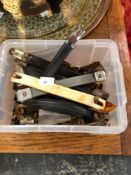A COLLECTION OF SUITCASE HANDLES AND HINGES