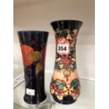 A MOORCROFT POMEGRANATE PATTERN VASE TOGETHER WITH ANOTHER MOORCROFT VASE