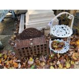 A SMALL PAINTED CAST IRON TWO TIER STAND TOGETHER WITH A SMALL CAST IRON FIRE BASKET