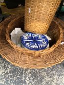 A PICNIC BASKET, TWO OTHER BASKETS AND BLUE AND WHITE POTTERY PLATES
