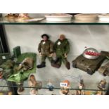 TWO ACTION MEN WITH KIT, A BATTERY OPERATED TANK AND ANOTHER BY TRIANG WITH FOUR RED BARRELS