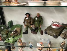 TWO ACTION MEN WITH KIT, A BATTERY OPERATED TANK AND ANOTHER BY TRIANG WITH FOUR RED BARRELS