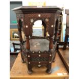 AN ISLAMIC HEXAGONAL TWO TIER TABLE INLAID WITH MOTHER OF PEARL STARS