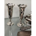 A PAIR OF HALLMARKED SILVER TRUMPET VASES, A SILVER WINE COASTER, CRUETS ETC.