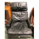 A BLACK LEATHER COVERED RETRO SWIVEL EASY CHAIR