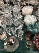 DECANTERS, VASES AND A LARGE QUANTITY OF DRINKING GLASS