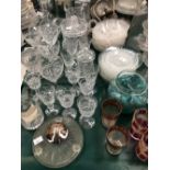 DECANTERS, VASES AND A LARGE QUANTITY OF DRINKING GLASS