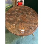 AN UNUSUAL CARVED ETHNIC CENTRE TABLE