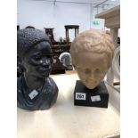 A WAX COMPOSITION HEAD OF A BOY TOGETHER WITH BUST OF A BLACK LADY