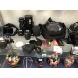 AN OLYMPUS OM 10 CAMERA, 4 LENSES, A FERGUSON VIDEOSTAR FC31 CAMERA TOGETHER WITH CASES AND