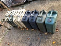 FOUR VINTAGE JERRY CANS AND FOUR WATER CANS