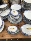 A LIMOGES DINNER SERVICE, EACH PIECE WITH A BLUE BORDER