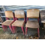 A SET OF EIGHTEEN VINTAGE STACKING CHAIRS