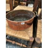 A COPPER COAL BUCKET AND A COPPER BRASS HANDLED JAM PAN