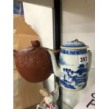 A CHINESE YIXING TEA POT AND COVER TOGETHER WITHA BLUE AND WHITE COFFEEPOT AND COVER