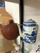 A CHINESE YIXING TEA POT AND COVER TOGETHER WITHA BLUE AND WHITE COFFEEPOT AND COVER