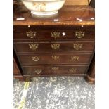 A GEORGIAN MAHOGANY SMALL FOUR DRAWER CHEST WITH BRUSHING SLIDE. W 76 D 45 H 81cms