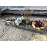 A TERRACOTTA BIRD BATH, A GARDEN FIGURE AND TWO RECTANGULAR PLANTERS.