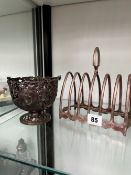 A LARGE HALLMARKED SILVER TOAST RACK, TOGETHER WITH A SILVER PIERCED SWING BASKET.