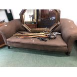 A LATE VICTORIAN CHESTERFIELD SETTEE ON TURNED EBONIZED LEGS. W 184cms