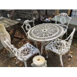 A PAINTED CAST ALLOY PATIO TABLE AND FOUR CHAIRS