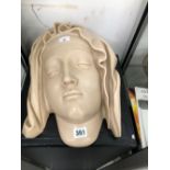 A WAX COMPOSITION MASK OF THE MADONNA