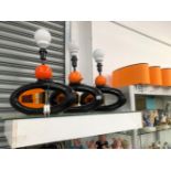 THREE RETRO ORANGE AND BLACK TABLE LAMPS WITH SHADES