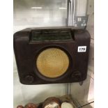 A BUSH RADIO IN A BROWN BAKELITE CASE