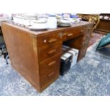 AN ART DECO OAK PEDESTAL DESK. H 75 W 137 D 77cms