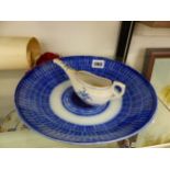 A BLUE AND WHITE FEEDER CUP AND FOLEY BLUE AND WHITE BOWL.