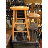 THREE SMALL WOODEN MILKING STOOLS AND A PAINTED BAR STOOL.