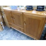 AN ERCOL ELM SIDEBOARD