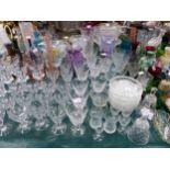 A LARGE COLLECTION OF CUT GLASS DRINKING WARES, VASES ETC.