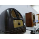 A VINTAGE BAKELITE RADIO AND A GEC WALNUT CASE RADIO.