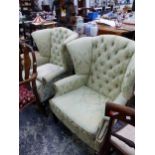 A PAIR OF WING BACK ARMCHAIRS