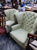 A PAIR OF WING BACK ARMCHAIRS