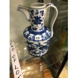 A CHINESE BLUE AND WHITE EWER PAINTED WITH A BAND OF FLOWERS, SIX CHARACTER MARK BELOW THE SPOUT