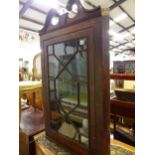 A GEORGIAN GLAZED OAK CORNER CABINET